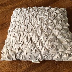 Cream pin tuck accent pillow